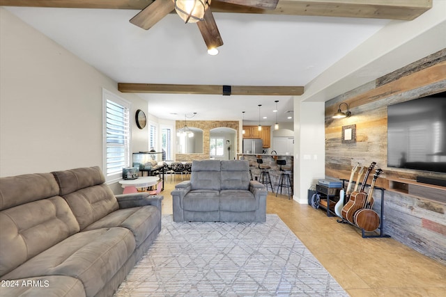 living room with ceiling fan and light tile patterned floors