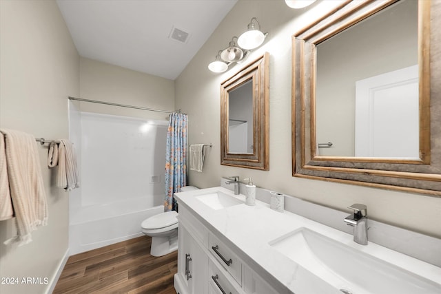 full bathroom with vanity, shower / tub combo with curtain, toilet, and wood-type flooring