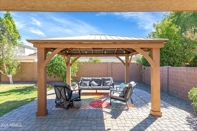 view of patio / terrace featuring an outdoor living space and a gazebo