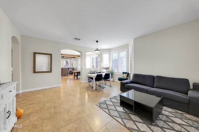 living room with light tile patterned floors