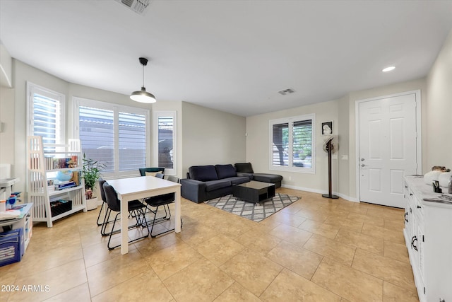 living room with light tile patterned flooring