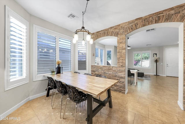 dining area featuring light tile patterned floors