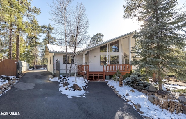 view of front of home featuring fence