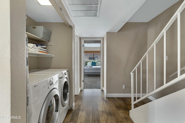 laundry room featuring separate washer and dryer and dark hardwood / wood-style floors