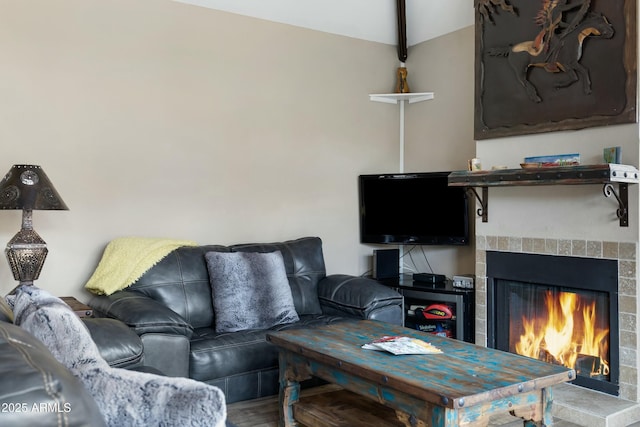 living room with vaulted ceiling and hardwood / wood-style floors