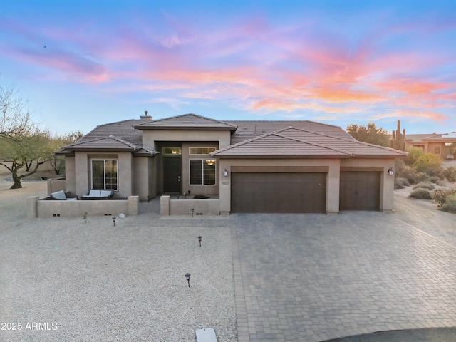 19023 E Buckskin Ct, Rio Verde, AZ 85263 - view of front of house featuring a tile roof, stucco siding, and a garage
