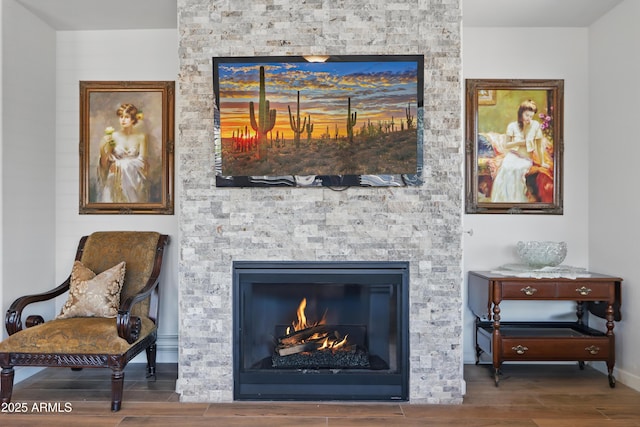 19023 E Buckskin Ct, Rio Verde, AZ 85263 - room details with baseboards, wood finish floors, and a stone fireplace