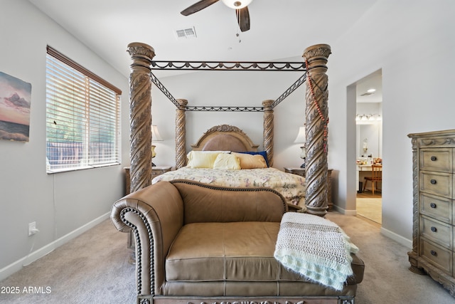 19023 E Buckskin Ct, Rio Verde, AZ 85263 - bedroom with baseboards, ensuite bathroom, visible vents, and light carpet