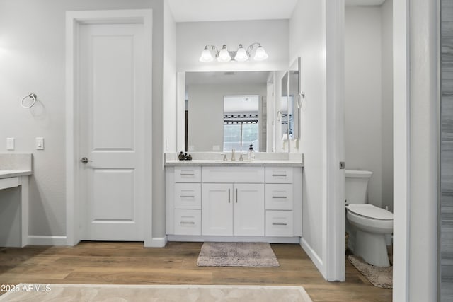 19023 E Buckskin Ct, Rio Verde, AZ 85263 - full bath with toilet, wood finished floors, baseboards, and vanity