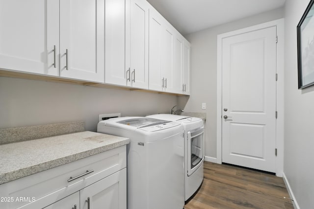 19023 E Buckskin Ct, Rio Verde, AZ 85263 - clothes washing area featuring washing machine and clothes dryer, dark wood-style flooring, cabinet space, and baseboards