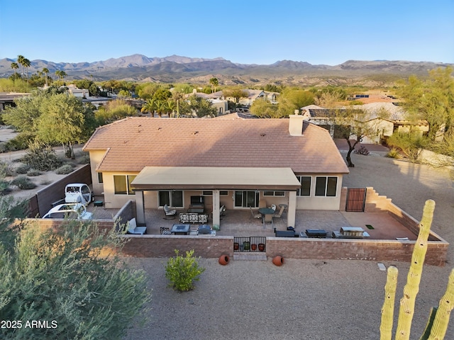 19023 E Buckskin Ct, Rio Verde, AZ 85263 - rear view of house featuring a fenced backyard, stucco siding, a patio area, and a mountain view