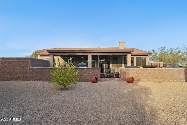 19023 E Buckskin Ct, Rio Verde, AZ 85263 - view of front of house featuring a chimney, stucco siding, fence, and a patio