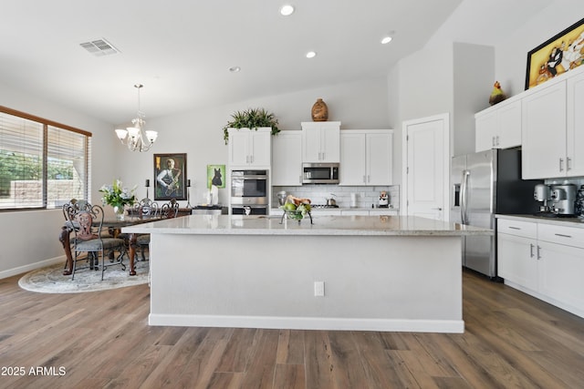 19023 E Buckskin Ct, Rio Verde, AZ 85263 - kitchen featuring white cabinetry, appliances with stainless steel finishes, a chandelier, and visible vents