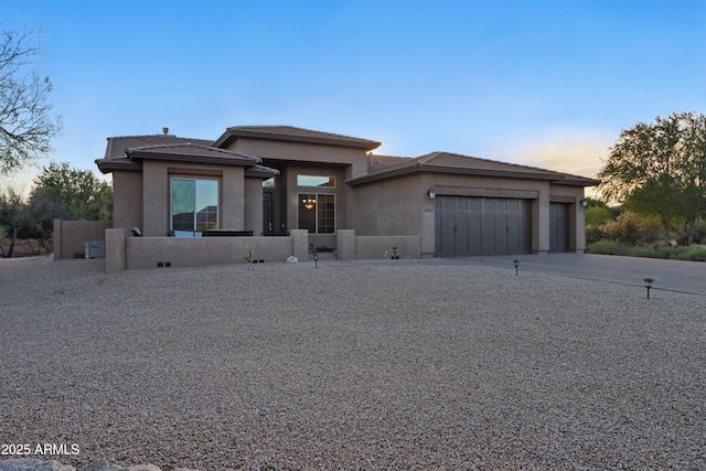 19023 E Buckskin Ct, Rio Verde, AZ 85263 - view of front of house with driveway, stucco siding, and an attached garage