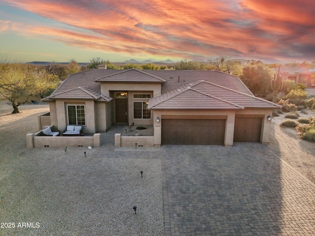 19023 E Buckskin Ct, Rio Verde, AZ 85263 - view of front of house with a tile roof, stucco siding, a garage, and a chimney