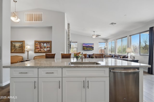 19023 E Buckskin Ct, Rio Verde, AZ 85263 - kitchen with lofted ceiling, visible vents, stainless steel dishwasher, and open floor plan