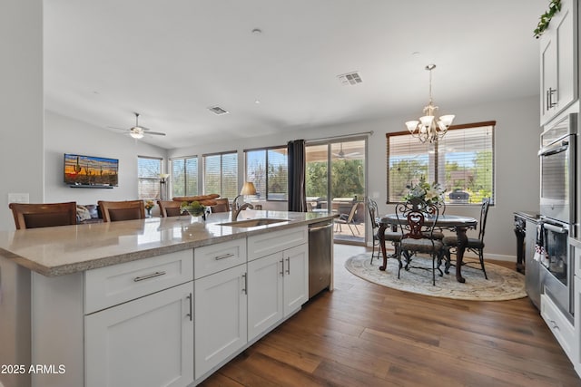 19023 E Buckskin Ct, Rio Verde, AZ 85263 - kitchen featuring a sink, stainless steel appliances, visible vents, white cabinets, and dark wood-type flooring