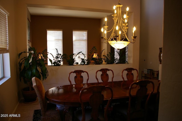 dining space featuring a notable chandelier