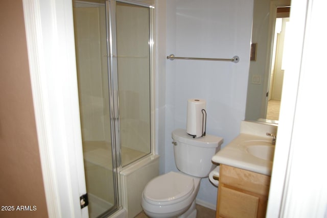 full bath with toilet, a stall shower, and vanity