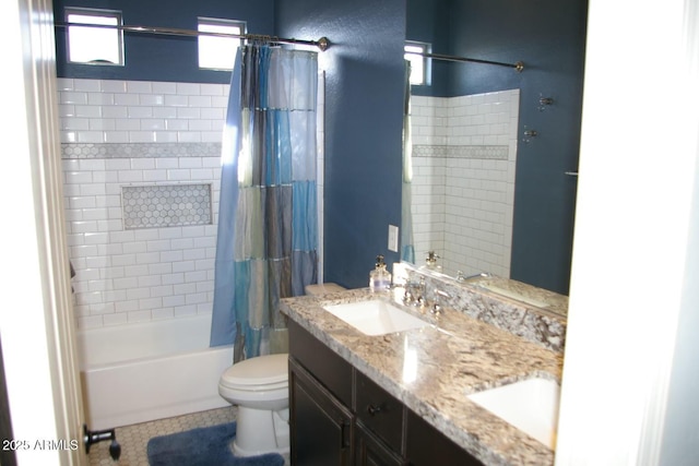 bathroom with shower / bath combo, vanity, and toilet