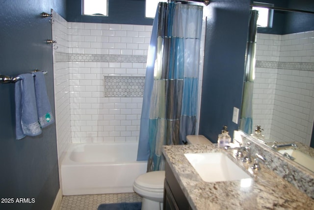 bathroom featuring vanity, tile patterned flooring, toilet, and shower / tub combo with curtain