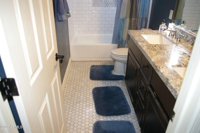 full bathroom with vanity, shower / bath combination with curtain, tile patterned flooring, and toilet