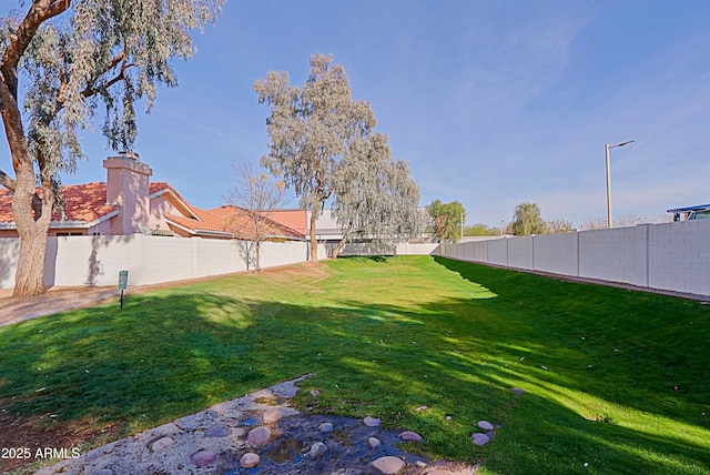 view of yard featuring a fenced backyard