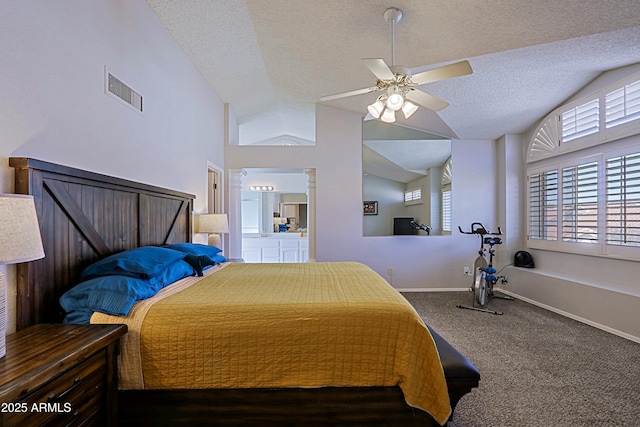 bedroom featuring lofted ceiling, visible vents, dark carpet, and a textured ceiling