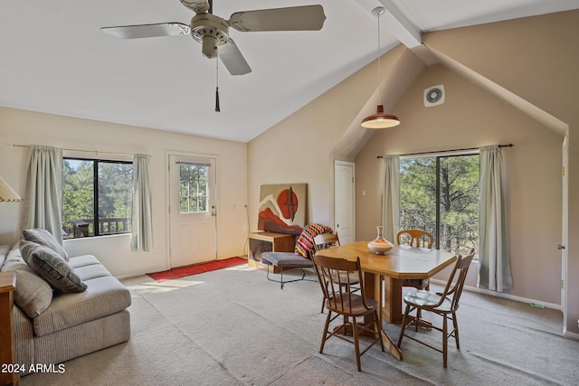 dining area with light carpet, beam ceiling, ceiling fan, and high vaulted ceiling