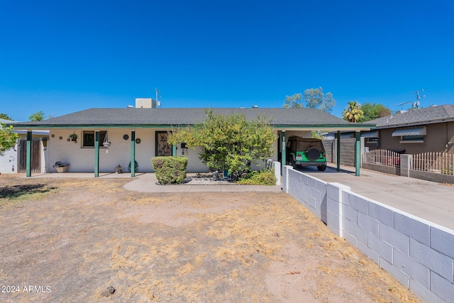 single story home with a carport