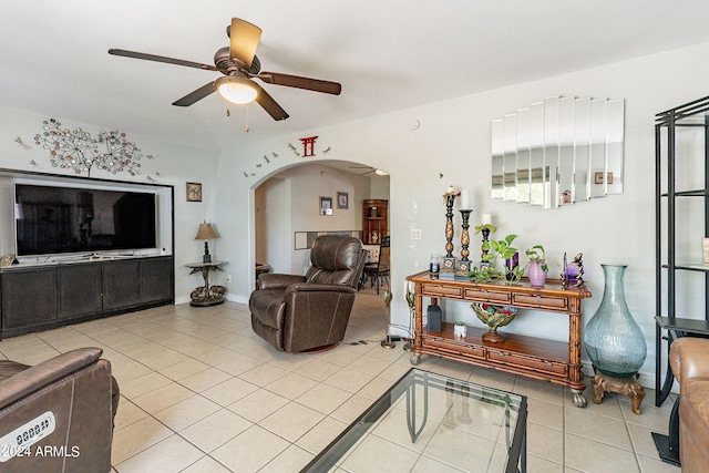 tiled living room featuring ceiling fan