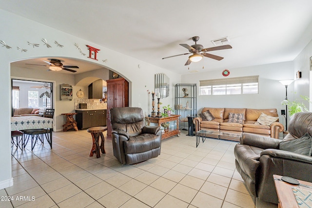 living room with ceiling fan and light tile patterned floors