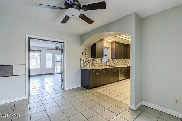 living room featuring tile patterned floors, ceiling fan, and a textured ceiling