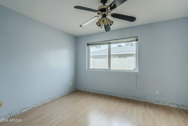 tiled dining space with ceiling fan