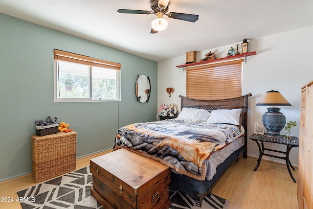 bedroom featuring ceiling fan and light hardwood / wood-style flooring