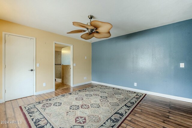 bedroom with light wood-type flooring and ceiling fan