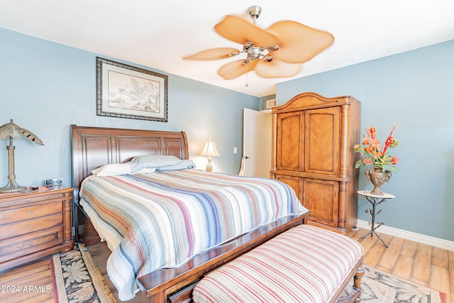 bedroom featuring light hardwood / wood-style floors and ceiling fan