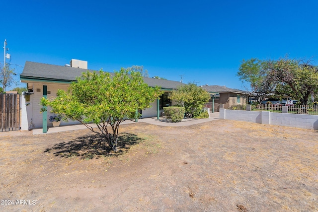 view of property hidden behind natural elements