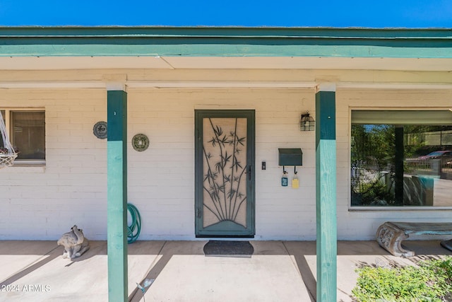 property entrance with a porch