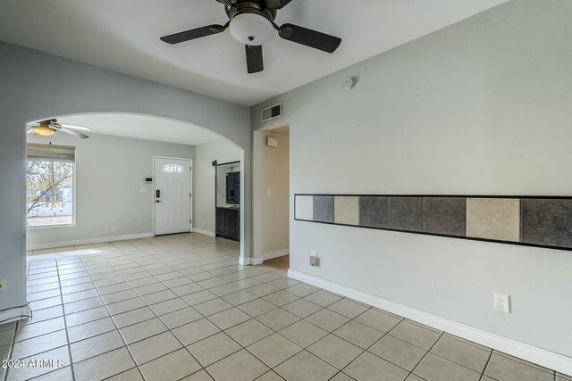 kitchen with tasteful backsplash, stainless steel dishwasher, ceiling fan, and sink