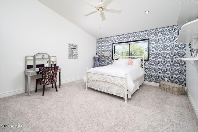 bedroom with ceiling fan, carpet flooring, and lofted ceiling