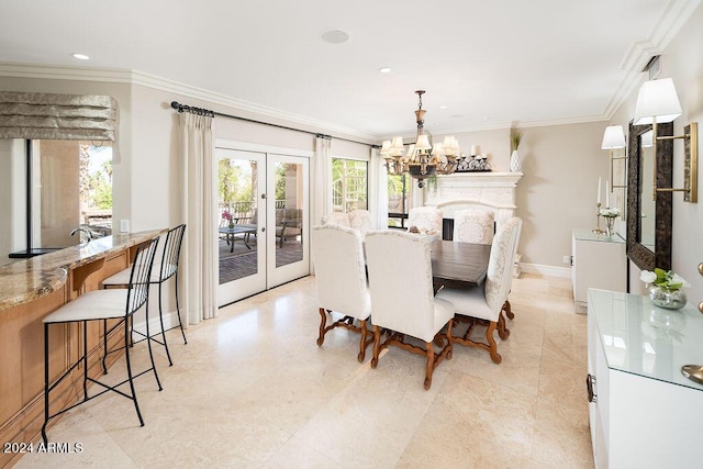 dining room with a chandelier, french doors, and ornamental molding