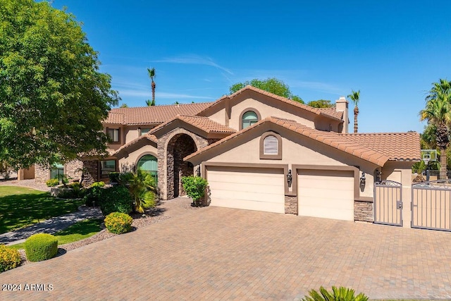 mediterranean / spanish-style home featuring a garage