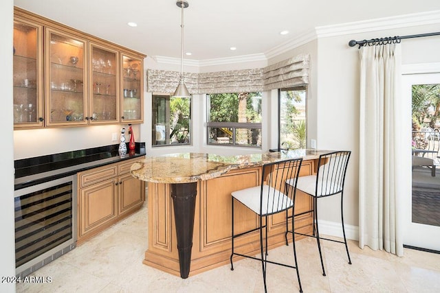 bar with light stone counters, hanging light fixtures, beverage cooler, and crown molding