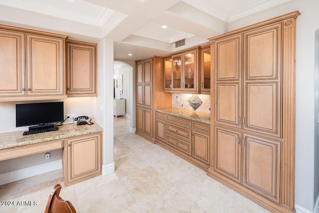 kitchen featuring light stone countertops, built in desk, backsplash, beam ceiling, and coffered ceiling