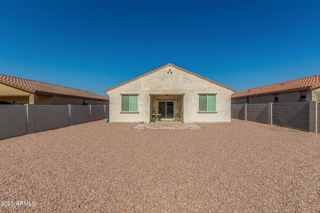 rear view of house with a patio