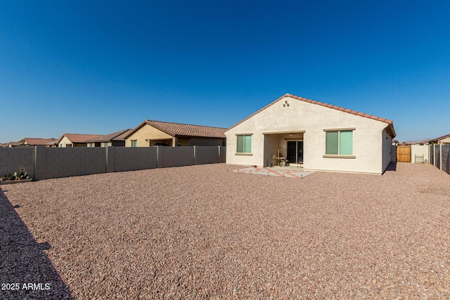 back of property with a patio area