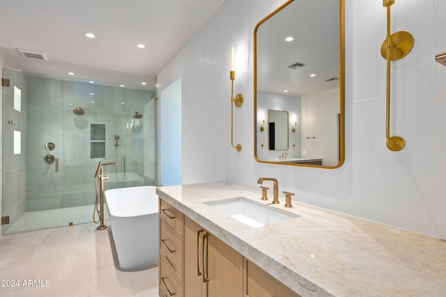 bathroom featuring vanity, plus walk in shower, and tile flooring