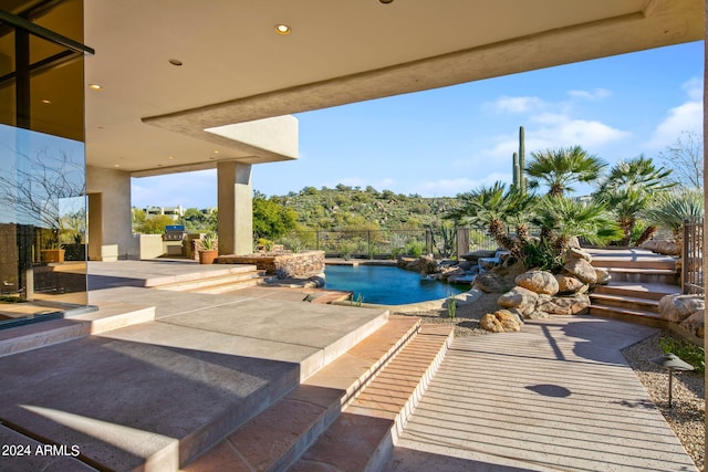 view of swimming pool with a patio area