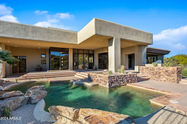 view of swimming pool with a patio